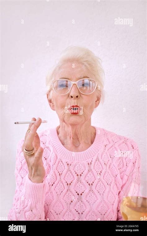 Beautiful Senior Woman Smoking Cigarette Hi Res Stock Photography And