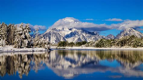 Cloud On White Covered Mountain In Grand Teton National Park With