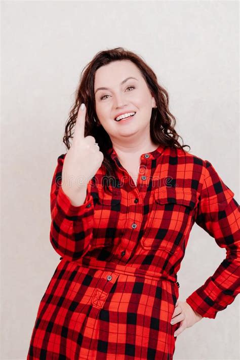 One Attractive Brunette Woman In Red Checkered Dress On White Shows