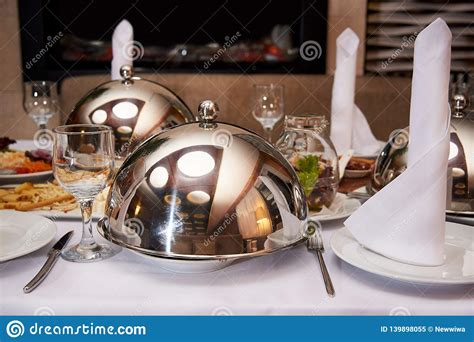 served dinner table hot dish on the dome tray on the server table stock image image of