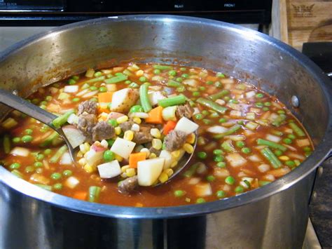 Add potatoes, tomato sauce, crushed whole tomatoes, undrained peas, corn, and green beans to the pot; Home Canning Vegetable Beef Soup