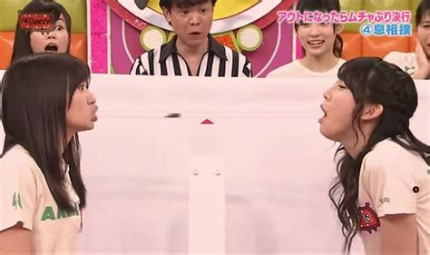 bizarre reality show two japanese girls try to shove dead cockroach down each other s throat