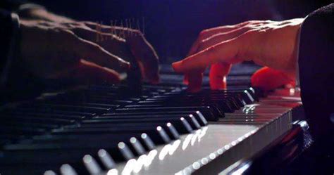 Classic Shot Of Pianist Playing Grand Piano With Cinematic Stage