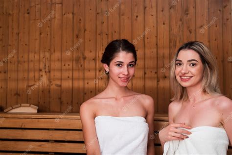 free photo friends posing relaxed in sauna