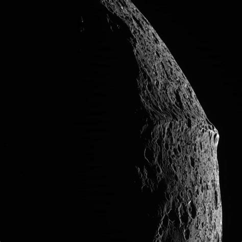 Bad Astronomy Iapetus Ridge May Have Been Created By A Huge Impact