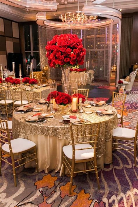 Gold Tables Topped With Tall Red Rose Centerpieces Las
