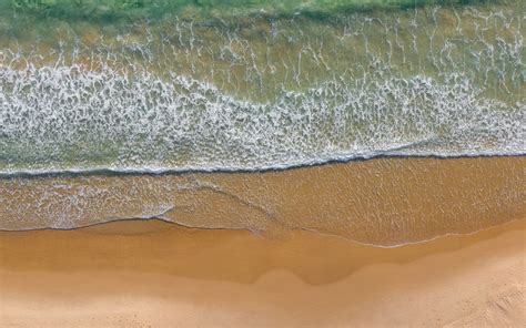 Download Wallpaper 1440x900 Sea Beach Aerial View Wave Surf Water