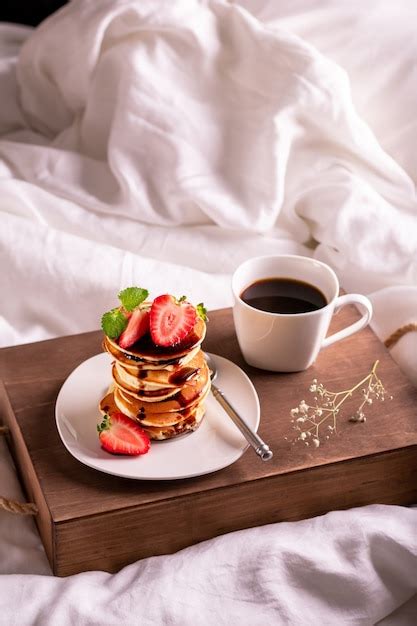 Premium Photo Morning Breakfast In Bed With Coffee And Strawberry