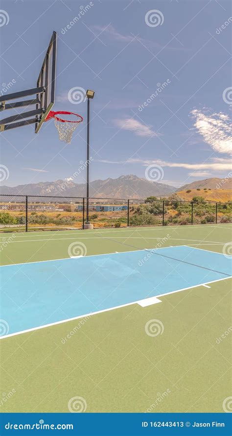 Vertical Outdoor Basketball Court And Nets On Sunny Day Stock Image