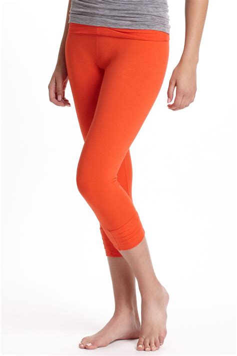 asana cropped leggings orange working out outfits blouse outfit yoga fashion
