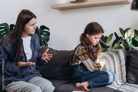 Sad Stubborn Little Daughter Kid Sit On Couch Back To Mom Feel Offended
