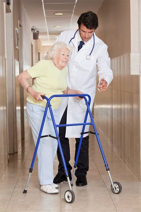 Doctor Helping Patient Use Walker Royalty Free Stock Images Image