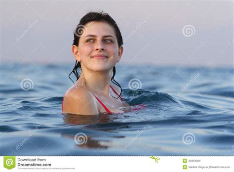 Young Girl Standing On Chest Deep In Seawater Stock Photo Image 44894304