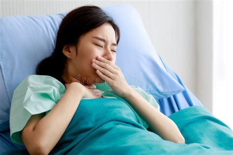 An Asian Young Beautiful Female Patient Getting Sick And Fever Having