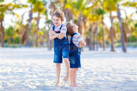 Two Little Kids Boys Having Fun On Tropical Beach Stock Photo Image