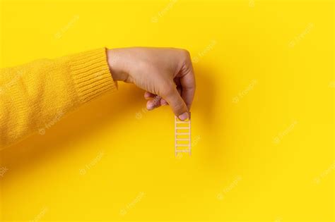 Premium Photo | Ladder in hand