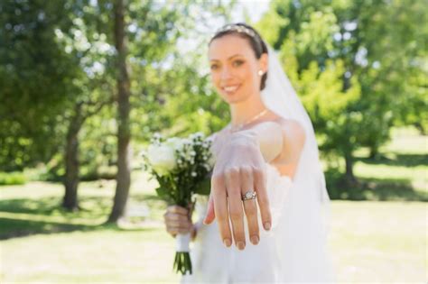 Premium Photo Beautiful Bride Showing Wedding Ring In Garden
