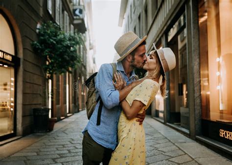 Couple Of Lovers Kissing On City Street Two Tourists Enjoying