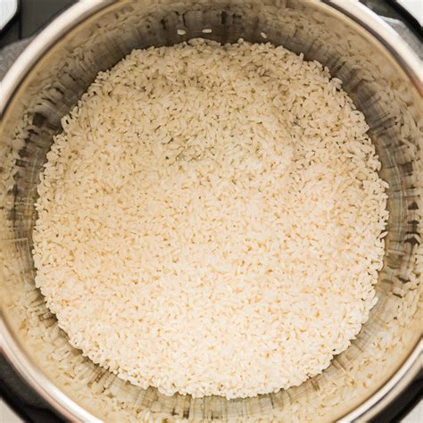 Rice Is Cooked In An Instant Pot On The Stove Top Ready To Be Cooked