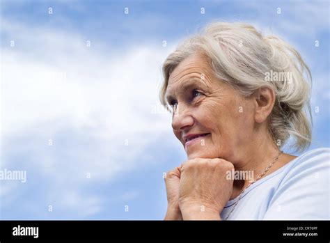 Beautiful Older Woman Stands On The Sky Stock Photo Alamy
