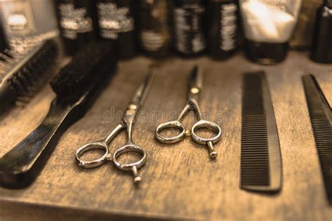 Professional Scissors And Combs Lie On A Shelf In A Hairdresser Stock