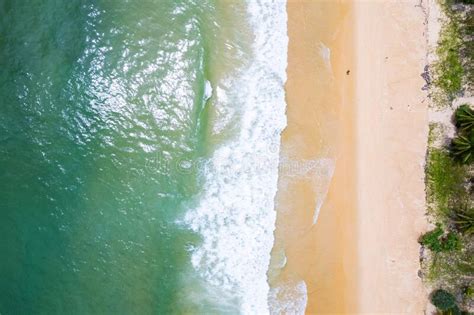Aerial View Sandy Beach And Waves Beautiful Tropical Sea In The Morning