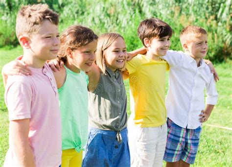 Five Kids Sitting On Grass Stock Photo Image Of Boys 260549394