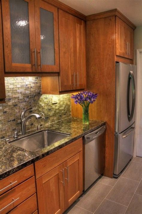 Home improvement expert bruce johnson shares some techniques for staining wood kitchen cabinets. The Perfect Finish for Your Tile | Cherry cabinets kitchen ...