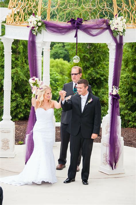 White Wedding Arch With Purple Draped Tulle