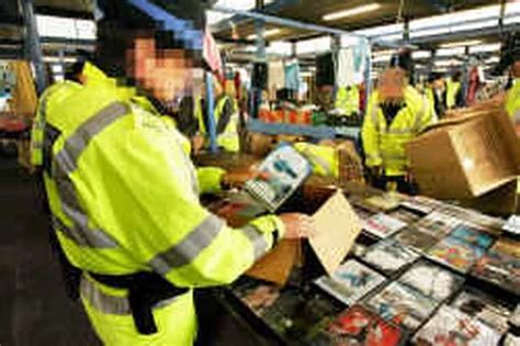 traders held in fakes raid manchester evening news