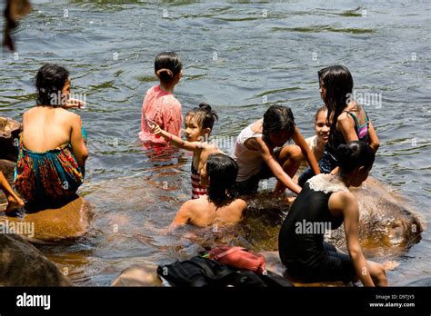 Local People Taking A Bath In The River At The Teuk Chhou Rapids In The Province Of Kampot