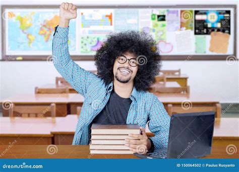 Excited Student Celebrates Success In The Classroom Stock Photo Image