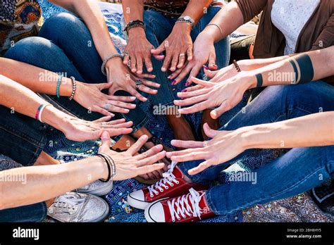 Close Up Top View Of People Putting Their Hands Together Friends With