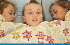 boys bed cousins two funny girls boy face expression stock between