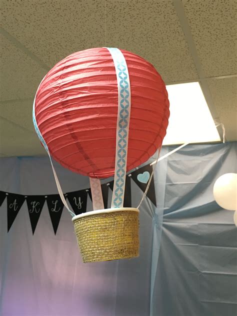 A Red Hot Air Balloon Is Suspended From The Ceiling