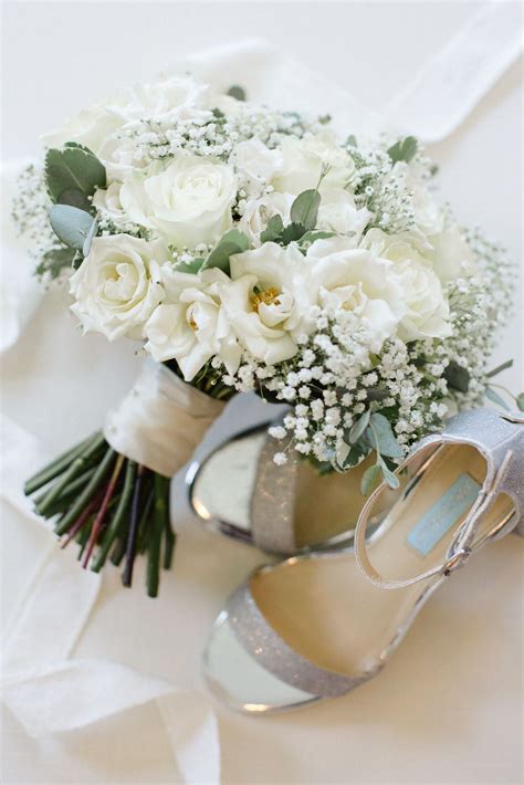 Black and silver brooch bouquet with cascading jewels. Silver wedding heels + white roses, baby's breath ...