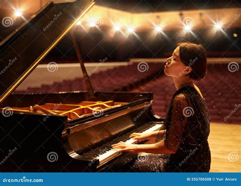 Music Is An Artform A Young Woman Playing The Piano During A Musical