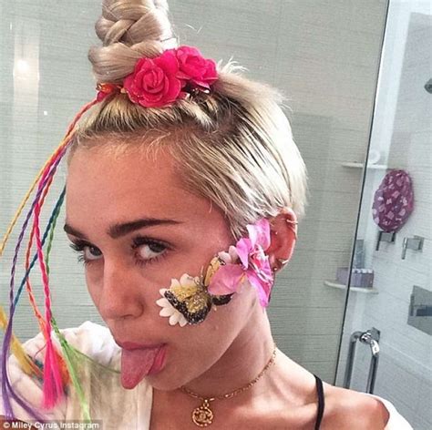 Look No Tongue Miley Cyrus Strips Down To Just Her Daisy
