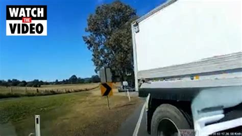 footage captures horrifying moment truck loses control slams into car the courier mail