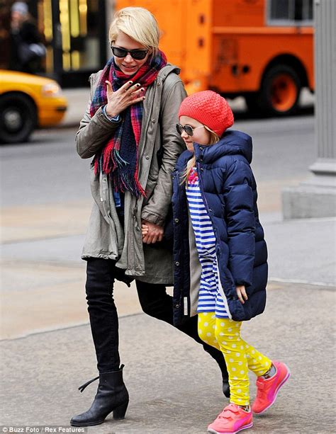 the best of friends michelle williams and matilda hold hands as they enjoy some mother daughter