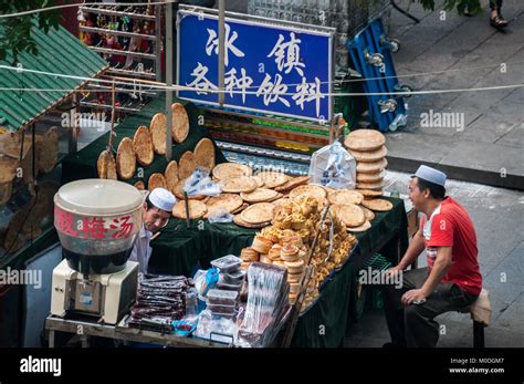 Two Muslim Sellers On Beiyuanmen Street In The Muslim Quarter Xian