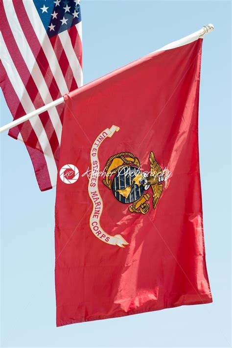 United States Marine Corps Flag Waving On Blue Sky Background Close Up