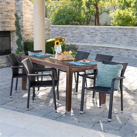 Hassan Outdoor 7 Piece Dining Set With Wood Table And Wicker Dining Chairs Dark Brown Finish