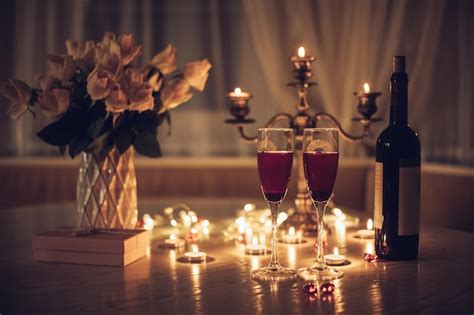 Premium Photo Candlelight Date Glasses With Wine Candles Bouquet Of