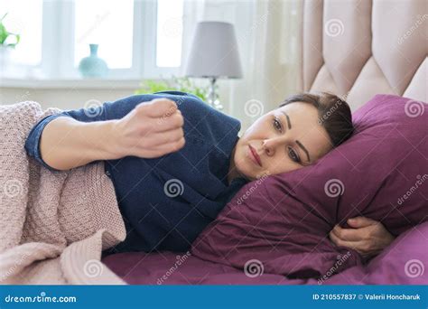 Daytime Sleep Concept Mature Woman Lying At Home On Bed With Pillow And Blanket Stock Image