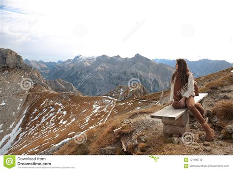 Outfit Of Casual Woman Brunette Sitting On Bench Enjoying Nature Above
