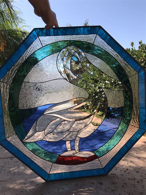 Its body has a swirl of earthy greens, as captivating as the effect a watercolor brush dipped into a glass of water has. Elegant! Octagon Beveled Pelican Leaded Stained Glass ...