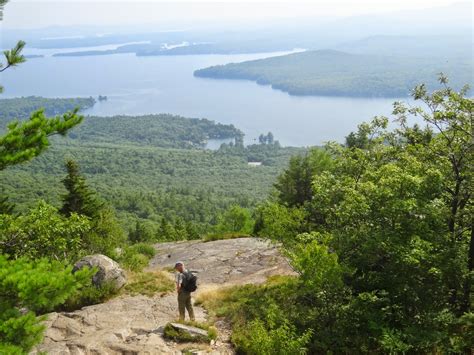 Outdoor Enthusiast Hiking Mount Major For A Panorama View Of Lake