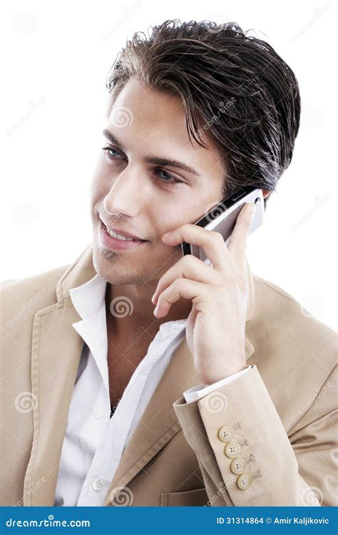 Hombre Joven Sofisticado Que Habla En El Teléfono Foto De Archivo