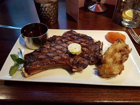 Beef drippings are the result of cooking beef. On the Bone Ribeye with Beef Dripping Sauce - Picture of ...